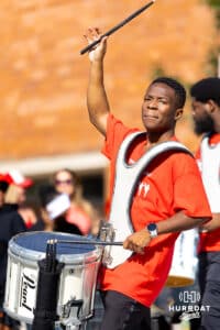 A man commands a three-piece drumline during the Terence "Bud" Crawford World Champion Victory Parade, Saturday, September 27, 2025, Omaha, Nebraska. Photo by Braden Cochran.