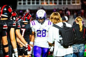 Omaha Central's Kaprice Keith (28) high-fives Westside players after winning the game after a high school football game @ Westside on Friday, September 26, 2025, in Omaha, Nebraska. Photo By Jack R. Stephens