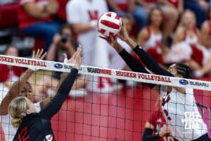 Nebraska Cornhusker outside hitter Taylor Landfair (12) blocks the ball against Maryland Terrapin outside hitter Katie Scherer (12) in the third set during a college volleyball match on Saturday, September 27, 2025, in Lincoln, Nebraska. Photo by John S. Peterson.