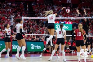 Nebraska Cornhusker middle blocker Andi Jackson (15) spikes the ball against the Maryland Terrapins in the third set during a college volleyball match on Saturday, September 27, 2025, in Lincoln, Nebraska. Photo by John S. Peterson.