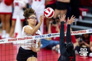 Nebraska Cornhusker middle blocker Rebekah Allick (5) bumps the ball over the net against Maryland Terrapin setter Nikki Tawil (22) during a college volleyball match on Saturday, September 27, 2025, in Lincoln, Nebraska. Photo by John S. Peterson.