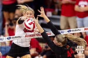 Nebraska Cornhusker middle blocker Andi Jackson (15) spikes the ball against Maryland Terrapin middle blocker Eva Rohrbach (44) in the second set during a college volleyball match on Saturday, September 27, 2025, in Lincoln, Nebraska. Photo by John S. Peterson.