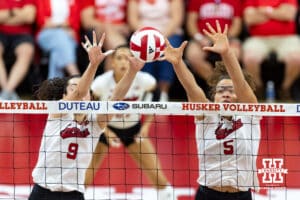 Nebraska Cornhusker middle blocker Rebekah Allick (5) jumps up to block a shot with Virginia Adriano against the Maryland Terrapins during a college volleyball match on Saturday, September 27, 2025, in Lincoln, Nebraska. Photo by John S. Peterson.