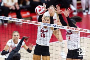 Nebraska Cornhusker middle blocker Andi Jackson (15) and outside hitter Teraya Sigler (11) blocks the ball against the Maryland Terrapins in the second set during a college volleyball match on Saturday, September 27, 2025, in Lincoln, Nebraska. Photo by John S. Peterson.