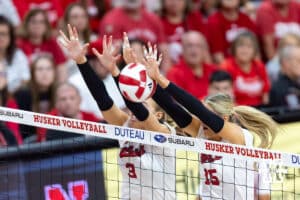 Nebraska Cornhusker middle blocker Andi Jackson (15) blocks the ball with opposite Allie Sczech (3) against the Nebraska Cornhuskers in the second set during a college volleyball match on Saturday, September 27, 2025, in Lincoln, Nebraska. Photo by John S. Peterson.
