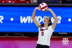 Nebraska Cornhusker opposite Virginia Adriano (9) sets the ball against the Maryland Terrapins in the second set during a college volleyball match on Saturday, September 27, 2025, in Lincoln, Nebraska. Photo by John S. Peterson.