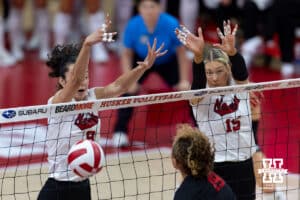 Nebraska Cornhusker opposite Virginia Adriano (9) with middle blocker Andi Jackson (15) blocks Maryland Terrapin outside hitter Olivia Ruy (19) in the first set during a college volleyball match on Saturday, September 27, 2025, in Lincoln, Nebraska. Photo by John S. Peterson.