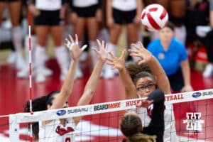 Nebraska Cornhusker middle blocker Rebekah Allick (5) and Virginia Adriano (9) jump up to block against the the first set Maryland Terrapins during a college volleyball match on Saturday, September 27, 2025, in Lincoln, Nebraska. Photo by John S. Peterson.