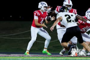 Jett Thomalla tosses the ball during the Millard South football game vs Lincoln Southeast on September 25th, 2025 in Omaha, Nebraska. Photo by Drew Balus