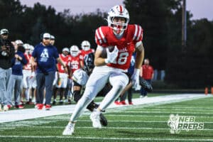 Isaac Jensen breaks a tackle during the Millard South football game vs Lincoln Southeast on September 25th, 2025, in Omaha, Nebraska. Photo by Drew Balus.