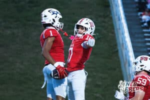Amarion Jackson and Owen Zech chest-bump during the Millard South football game vs Lincoln Southeast on September 25th, 2025, in Omaha, Nebraska. Photo by Drew Balus.