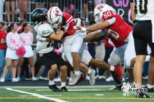 Urban Kennedy makes a backfield tackle during the Millard South football game vs Lincoln Southeast on September 25th, 2025, in Omaha, Nebraska. Photo by Drew Balus.