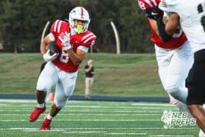 Gabe Prucha carries the football during the Millard South football game vs Lincoln Southeast on September 25th, 2025, in Omaha, Nebraska. Photo by Drew Balus.
