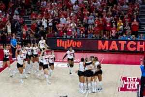 The Nebraska Cornhuskers celebrate the sweep against the Michigan Wolverines during a college volleyball match on Wednesday, September 24, 2025, in Lincoln, Nebraska. Photo by John S. Peterson.
