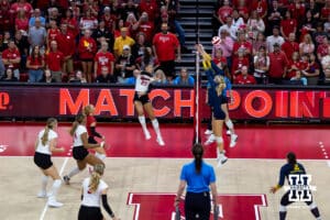 Nebraska Cornhusker Harper Murray (27) spikes the ball for match point in the third set against the Michigan Wolverines during a college volleyball match on Wednesday, September 24, 2025, in Lincoln, Nebraska. Photo by John S. Peterson.