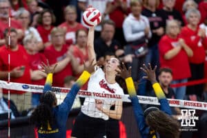 Nebraska Cornhusker Virginia Adriano (9) spikes the ball for a kill against the Michigan Wolverines in the second set during a college volleyball match on Wednesday, September 24, 2025, in Lincoln, Nebraska. Photo by John S. Peterson.
