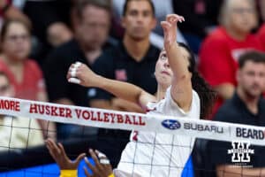 Nebraska Cornhusker Virginia Adriano (9) spikes the ball against the Michigan Wolverines in the second set during a college volleyball match on Wednesday, September 24, 2025, in Lincoln, Nebraska. Photo by John S. Peterson.