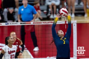Michigan Wolverine setter Morgan Burke (7), a former Skutt player, sets the ball against the Nebraska Cornhuskers in the second set during a college volleyball match on Wednesday, September 24, 2025, in Lincoln, Nebraska. Photo by John S. Peterson.