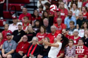 Nebraska Cornhusker Virginia Adriano (9) serves the ball against the Michigan Wolverines in the first set during a college volleyball match on Wednesday, September 24, 2025, in Lincoln, Nebraska. Photo by John S. Peterson.
