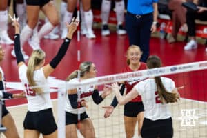 The Nebraska Cornhuskers celebrate a point against the Michigan Wolverines in the first set during a college volleyball match on Wednesday, September 24, 2025, in Lincoln, Nebraska. Photo by John S. Peterson.