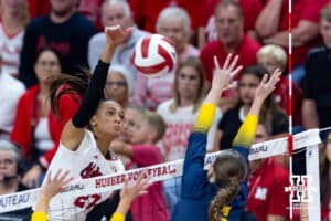 Nebraska Cornhusker Harper Murray (27) spikes the ball against Michigan Wolverine setter Ellie White (6) in the first set during a college volleyball match on Wednesday, September 24, 2025, in Lincoln, Nebraska. Photo by John S. Peterson.