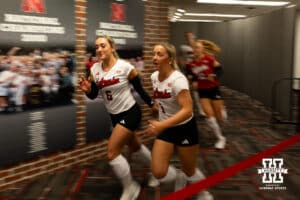 Nebraska Cornhuskers Laney Choboy (6) and Keri Leimbach (1) lead the Huskers out to the court to take on the Michigan Wolverines during a college volleyball match on Wednesday, September 24, 2025, in Lincoln, Nebraska. Photo by John S. Peterson.