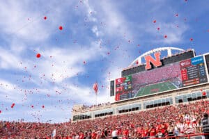Husker fans release the balloons after the first Husker score during a college football game between Nebraska and Michigan on Saturday, September 20, 2025, in Lincoln, Nebraska. Photo by John S. Peterson.
