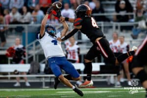 Pierce Cornerback Ryder Thiesen (4) lays out for the interception against Fort Calhoun runningback Blake Welchert (4) during a high school football game, Friday, September 19th, 2025, Fort Calhoun, Nebraska. Photo by Braden Cochran.