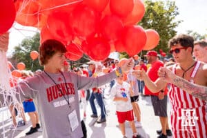 Huskers fans getting their balloons for the balloon release before Nebraska takes on Michigan during a college football game on Saturday, September 20, 2025, in Lincoln, Nebraska. Photo by John S. Peterson.