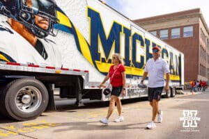 A of Husker fans walking by the Michigan equipment truck before Nebraska takes on Michigan during a college football game on Saturday, September 20, 2025, in Lincoln, Nebraska. Photo by John S. Peterson.