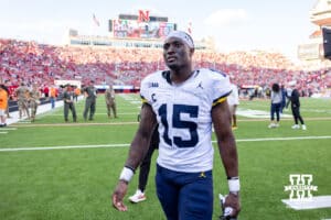 Former Husker Michigan Wolverine Ernest Hausmann (15) walks back to the locker room during a college football game on Saturday, September 20, 2025, in Lincoln, Nebraska. Photo by John S. Peterson.