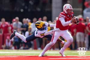 Nebraska Cornhusker Dylan Raiola (15) breaks a tackle against the Michigan Wolverines during a college football game on Saturday, September 20, 2025, in Lincoln, Nebraska. Photo by John S. Peterson.