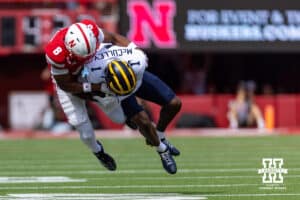 Nebraska Cornhusker DeShon Singleton (8) tackles Michigan Wolverine Donaven McCulley (1) during a college football game on Saturday, September 20, 2025, in Lincoln, Nebraska. Photo by John S. Peterson.