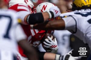 Nebraska Cornhusker Emmett Johnson (21) runs with the ball against the Michigan Wolverines in the first quarter during a college football game on Saturday, September 20, 2025, in Lincoln, Nebraska. Photo by John S. Peterson.