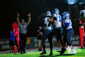 Boys Town's Khyren Wilson (24), Jack Reilly (12), and History Mathis (56) celebrate a rushing touchdown during a high school football game against Lincoln Lutheran on Thursday, September 18, 2025, in Lincoln, Nebraska. Photo By Jack Stephens.