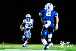 Boys Town's Shawn Lewis (2) running for a first down during a high school football game against Lincoln Lutheran on Thursday, September 18, 2025, in Lincoln, Nebraska. Photo By Jack Stephens.