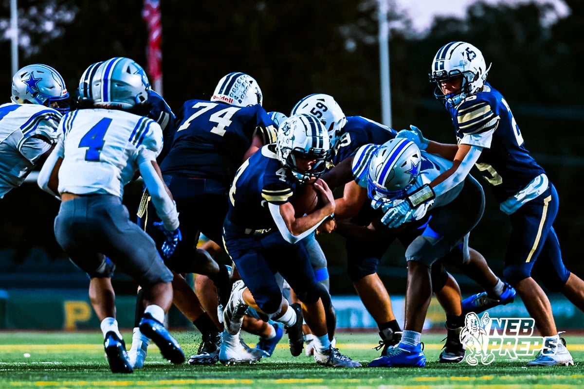 Lincoln Lutherans Henry Prokop (4) running through traffic during a high school football game against Boys Town on Thursday, September 18, 2025, in Lincoln, Nebraska. Photo By Jack Stephens.