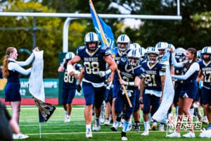 Lincoln Lutheran running out before the high school football game against Boys Town on Thursday, September 18, 2025, in Lincoln, Nebraska. Photo By Jack Stephens.