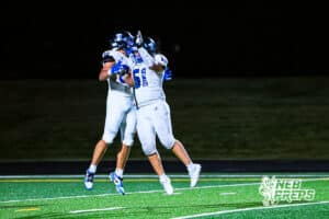 Papio South's Pierson Ivener (82) and Gage Burki (51) celebrate after scoring a touchdown during the game @ Millard North on Friday, September 12, 2025, in Millard, Nebraska. Photo by Jack Stevens.