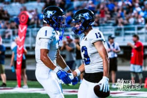 Papio South's Brady Alderson (1) and Devin Cotton (13) celebrate after scoring a passing touchdown during the game @ Millard North on Friday, September 12, 2025, in Millard, Nebraska. Photo by Jack Stevens.