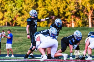 Millard North's Cameron Leggett (7) under center before a play during the game VS Papio South on Friday, September 12, 2025, in Millard, Nebraska. Photo by Jack Stevens.
