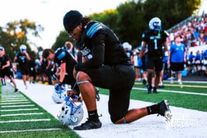 Millard North's Zion Rush (13) is praying before the game VS Papio South on Friday, September 12, 2025, in Millard, Nebraska. Photo by Jack Stevens.