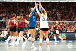 Creighton Bluejays Ava Martin (8) and Saige Darrow (13) high five during a volleyball match against Nebraska on Tuesday, September 16th, 2025 in Omaha, Nebraska. Photo by Brandon Tiedemann.