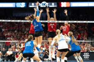 Creighton Bluejay Ava Martin (8) looks to get past the Husker defense during a volleyball match against Nebraska on Tuesday, September 16th, 2025 in Omaha, Nebraska. Photo by Brandon Tiedemann.