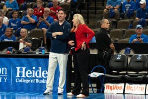 Creighton Bluejay head coach Brian Rosen and Nebraska Cornhusker head coachDani Busboom Kelly talk before a volleyball match on Tuesday, September 16th, 2025 in Omaha, Nebraska. Photo by Brandon Tiedemann.