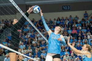 Creighton Bluejays Annalea Maeder (17) meets a player at the net during a volleyball match against Louisville on Friday, September 12th, 2025 in Omaha, Nebraska. Photo by Brandon Tiedemann.
