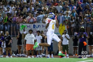 Re'aire Washington catches a deep ball and runs for a touchdown during the Omaha North football game vs Central on September 12th, 2025 in Omaha, Nebraska. Photo by Drew Balus