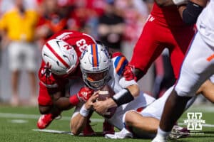 Nebraska Cornhusker Marques Watson-Trent (33) tackles Houston Christian Husky quarterback Jake Weir (16) during a college football game on Saturday, September 13, 2025, in Lincoln, Nebraska. Photo by John S. Peterson.