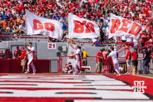 Nebraska Cornhuskers cheer squad run the Go Big Red flags in the endzone after a field in the first quarter against the Houston Christian Huskies during a college football game on Saturday, September 13, 2025, in Lincoln, Nebraska. Photo by John S. Peterson.