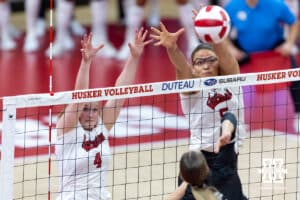 Nebraska Cornhuskers Campbell Flynn (4) and Rebekah Allick (5) jump up to block the ball against Grand Canyon Lope Sophia Parlanti (2) in the third set during a college volleyball match on Saturday, September 13, 2025, in Lincoln, Nebraska. Photo by John S. Peterson.